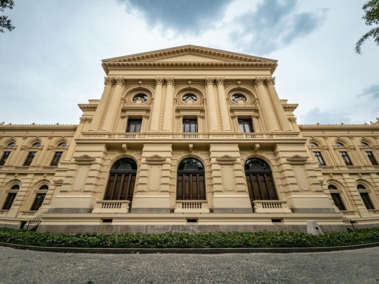 Stunning neoclassical architecture of a museum in São Paulo, captured on a cloudy day.