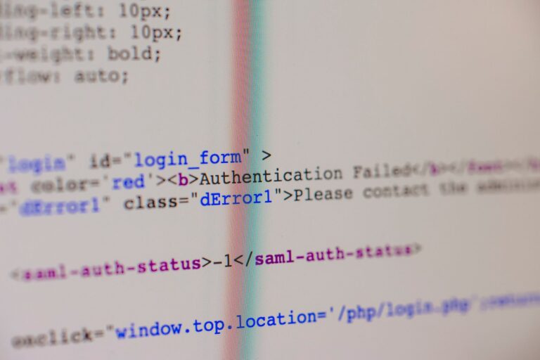 Close-up of HTML and PHP code on screen showing error message and login form data.